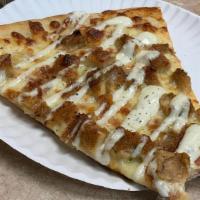 Chicken Bacon Ranch Pizza · Breaded chicken and bacon bits on a bed of mozzarella drizzled with Ranch dressing.