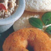 1 Idly & 1 Vada · Combination of one steamed rice cake and lentil doughnut served with chutney and sambar.