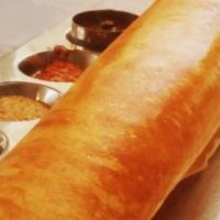Ghee Masala Dosa · Thin rice and lentil crepe filled with potatoes and onions paper dosa. Served with three var...