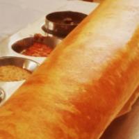 Ghee Roast Dosa · Thin rice and lentil crepe sprinkled with ghee. Served with three varieties of chutneys and ...