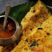 Ghee Rava Dosa · Thin crispy crepe from semolina and rice sprinkled with ghee, mildly spiced and garnished an...