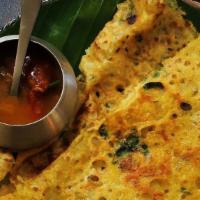 Ghee Rava Masala Dosa · Thin crispy crepe from semolina and rice sprinkled with ghee, mildly spiced and garnished st...