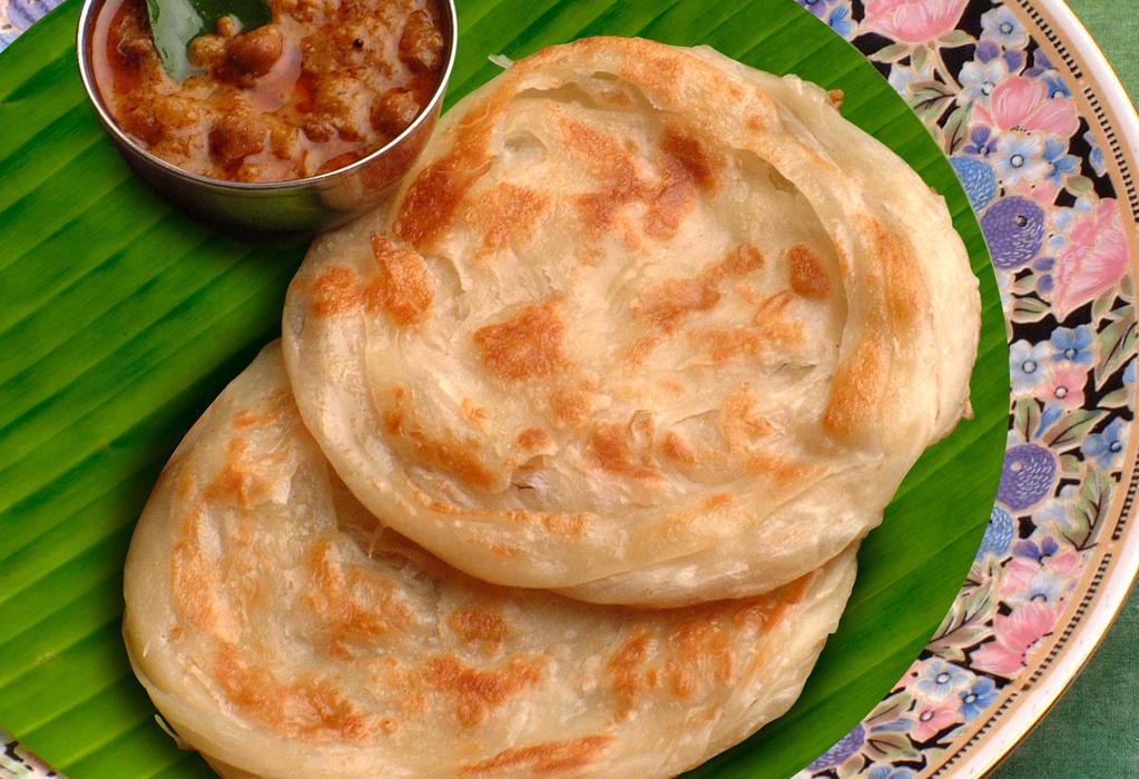 Parotta · Delicious south indian fluffy bread served with veg curry and potato masala.