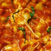 Gnocchi Al Telefono · Homemade potato pasta with tomato sauce, diced fresh mozzarella, basil.