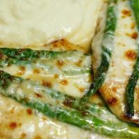 Pollo Montecarlo · Chicken breast sauteed with shallots, asparagus, melted mozzarella in a champagne sauce.