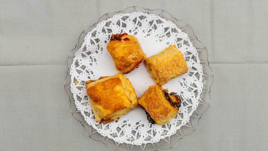 Rugelach · Flaky sour cream dough filled with cinnamon, apple, raspberry, or chocolate.