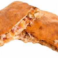 Chick N Bacon · Calzone filled with breaded chicken, mozzarella cheese and bacon.  Served with a side of Mar...