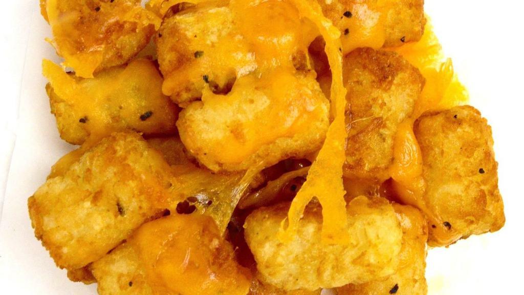 Cheesy Tots · Cheddar Cheese melted over seasoned Tots.