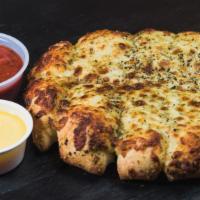 Cheese Stix · Fresh Mozzarella Cheese, Parmesan, and Italian spices Baked on top of Hand Stretched D.P. Do...