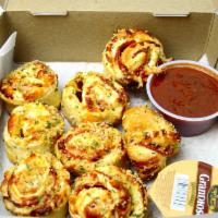 Roni Rolls · Pepperoni and Mozzarella rolled in D.P. Dough, cut into 8 pieces, and topped with garlic Par...