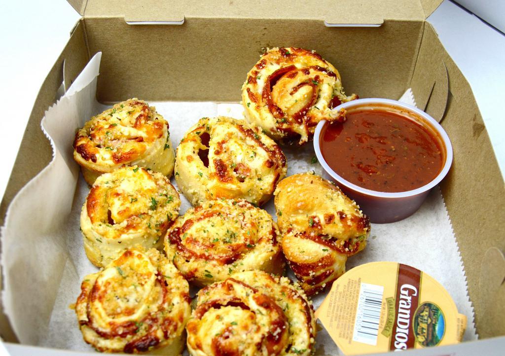 Roni Rolls · Pepperoni and Mozzarella rolled in D.P. Dough, cut into 8 pieces, and topped with garlic Parmesan.