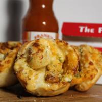 Buffer Rolls · Breaded Chicken, Mozzarella, Hot Sauce and Ranch rolled into D.P Dough ball and cut into dip...