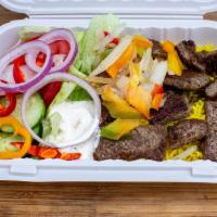 Lamb Over Rice Platter · Our speciality slow-cooked lamb served with basmati rice, lettuce, tomatoes, onions, sweet p...