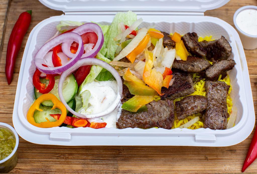 Lamb Over Rice Platter · Our speciality slow-cooked lamb served with basmati rice, lettuce, tomatoes, onions, sweet pepper, and your choice of sauce.