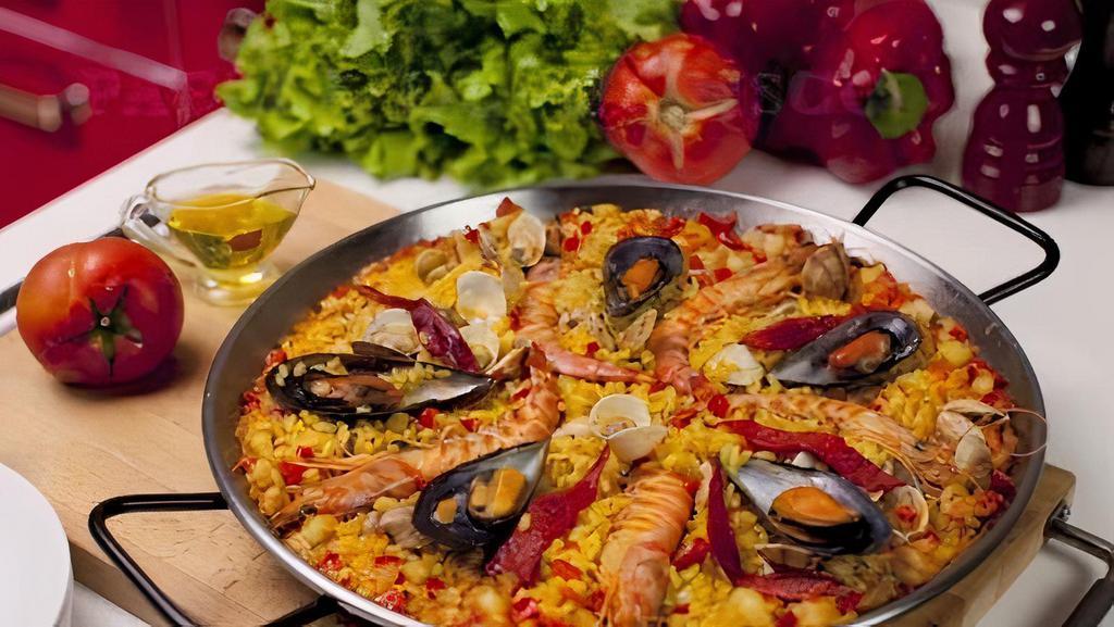 Paella De Camarones (Shrimp) · Shrimp Paella. Shrimp, tomato sofrito, Arborio rice, market vegetables. Made-to-order, please allow an extra 20 minutes for all paella orders. Thank you.
