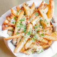 Truffle Fries · Tossed in 5 months aged grated parmesan cheese, parsley, black truffle oil drizzle