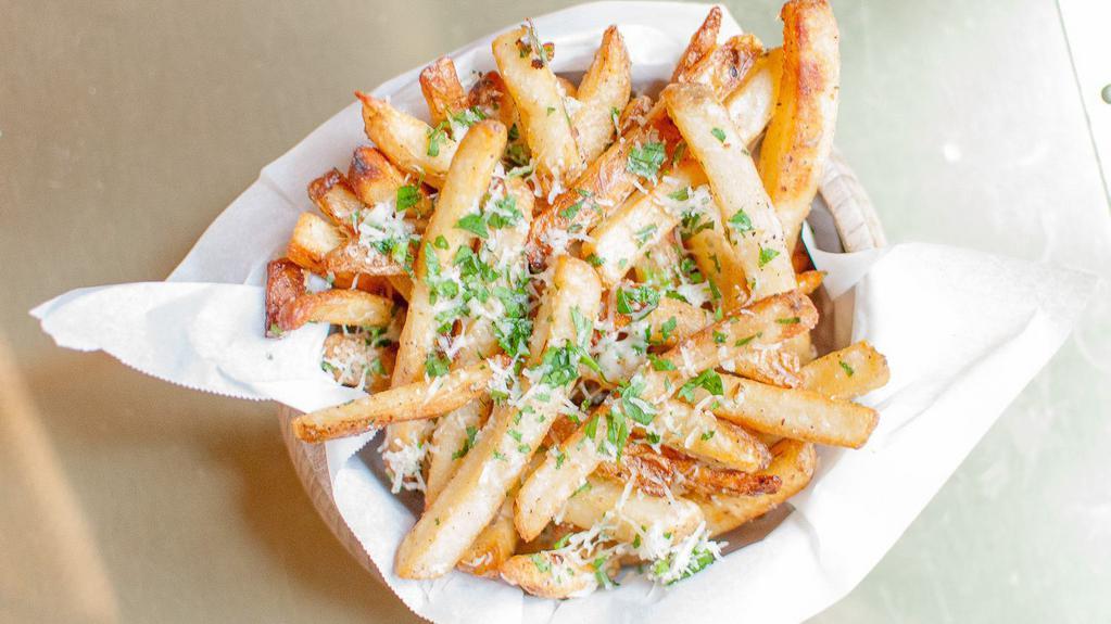Truffle Fries · Tossed in 5 months aged grated parmesan cheese, parsley, black truffle oil drizzle