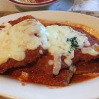 Veal Parmigiana · Made or covered with Parmesan cheese.