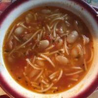 Pasta E Fagioli · With broken spaghetti, cannellini beans, and a rice, and flavorful broth.