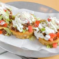 Sopes · Fried homemade corn tortilla topped with refried beans, spicy sauce; choice of meat, chicken...