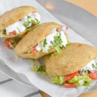 Gorditas (3 Pc) · Fried homemade tortilla stuffed with chicken, lettuce, sour cream, spicy sauce, and grated c...