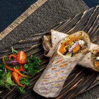 Veg Wrap · Freshly roasted, zucchini, eggplant, sweet potato, red onions finished with feta cheese, and...
