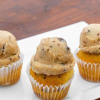 Chocolate Chip Cookie Dough Cupcake · Chocolate chip cake topped with a generous scoop of edible cookie dough