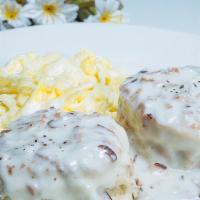 Country Breakfast · Buttermilk biscuits and homemade creamy gravy with scrambled eggs