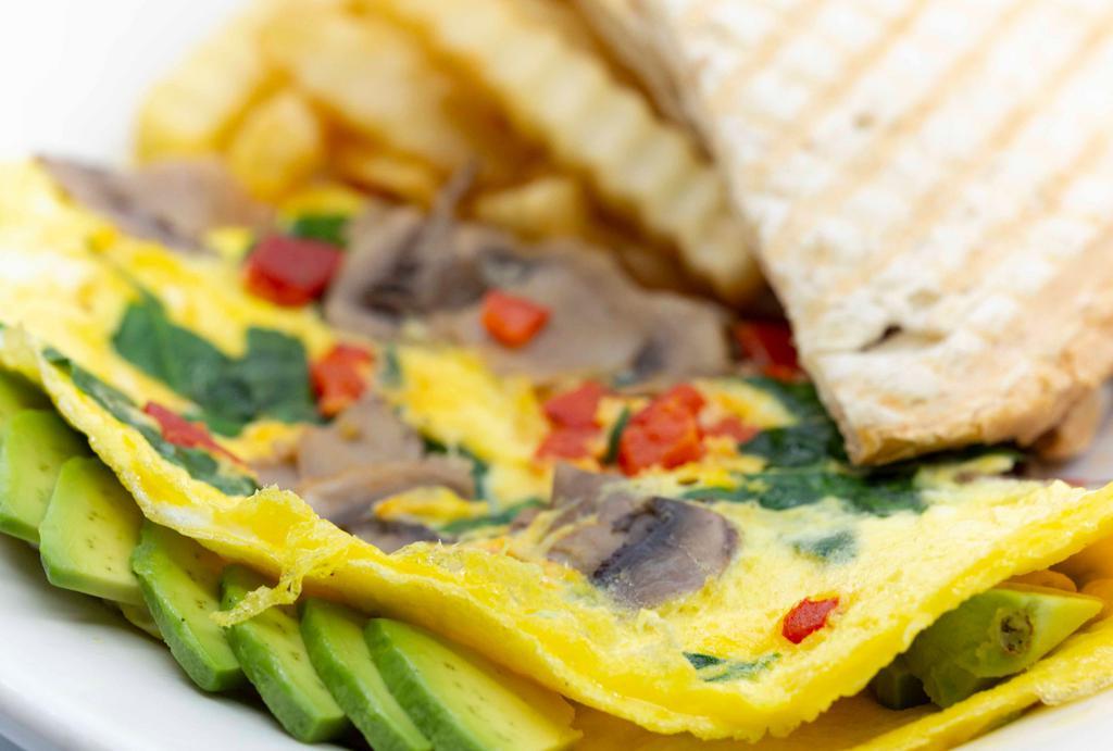 California Omelet · Eggs, spinach, mushroom, roasted red pepper and avocado