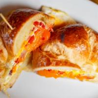 Southern Egg Sandwich · Omelet with roasted red peppers, red onion, and cheddar on a croissant