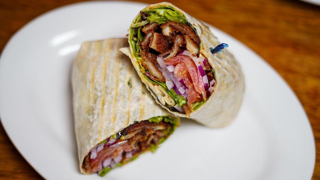 Chicken Milanese Wrap · Breaded chicken breast, lettuce, tomato, onion, chipotle mayo wrapped in a flour tortilla.