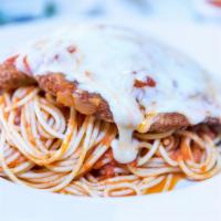 Chicken Parmesan · Linguini with homemade marinara sauce with breaded chicken and mozzarella cheese on top.