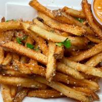 Mexican Papas Fritas · Freshly cut potatoes, fried and topped with cotija cheese, chilie powder, cilantro and chipo...