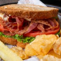 Blt Sandwich · Bacon, lettuce, and tomato with mayo served with pickle and chips. Multi-grain toast.