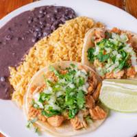 Soft Corn Tortilla Tacos (2) · Topped with chopped cilantro and onions.