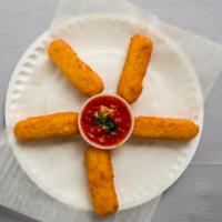 Mozzarella Sticks · Fried cheese perfection. Served with homemade marinara dipping sauce.