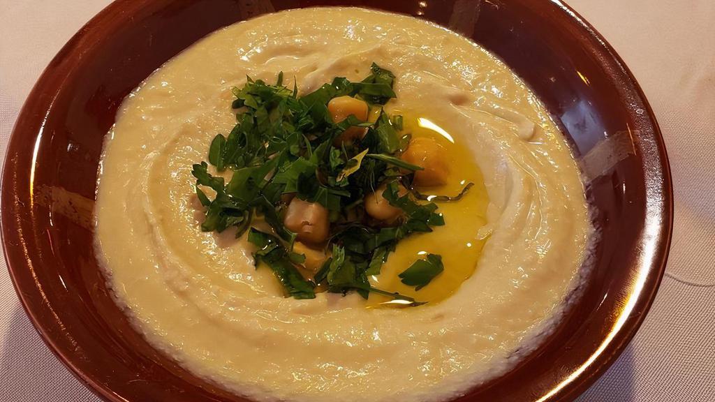 Plain Hummus · Mashed chickpeas blended with fresh garlic, tahini, and herbs.