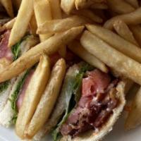 Turkey And Bacon Club · Comes with lettuce, tomato, and mayo. Served with French fries, coleslaw, and a pickle.
