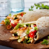 Chicken Burrito · Delicious juicy chicken with house special fiesta filling wrapped in a tortilla made to perf...