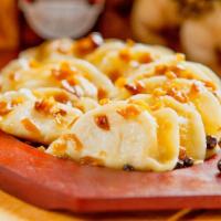 Meat Pierogi (Package) · Polish dumplings stuffed with cooked ground pork with spices in a hand-rolled soft dough. Be...