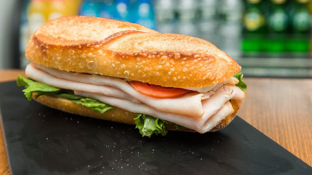 Fresh Turkey Brie  · Brie cheese, tomatoes, lettuce and honey mustard on a baguette.