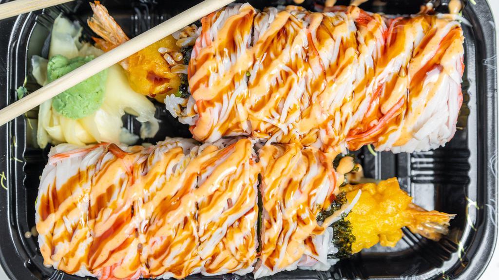 Lion Roll · Inside: fried shrimp tempura, eel, cucumber, avocado. Outside: crab meat.