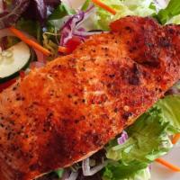Grilled Salmon Fillet Salad · 8-ounce Grilled fillet of salmon on top of mixed greens, romaine lettuce, tomatoes, cucumber...
