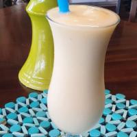 Pina Colada Smoothie · Made with fruit, soy or almond milk, and ice.