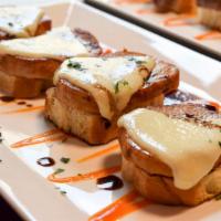 Pork Medallions · Served with toasted bread, tetilla cheese and piquillo peppers.