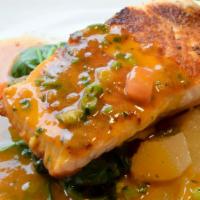 Salmon · Served with spinach, potato a la pobre and red pepper sauce.