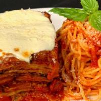 Eggplant Parmesan · Vegan. Layered eggplant topped with fresh buffalo mozzarella, side of spaghetti.