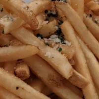 Truffle Fries · Fries tossed in truffle oil, Parmesan cheese and sprinkled with parsley.