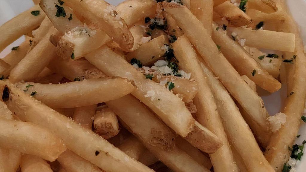 Truffle Fries · Fries tossed in truffle oil, Parmesan cheese and sprinkled with parsley.