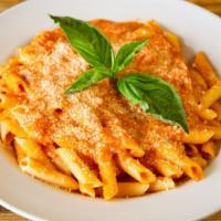 The Vodka Pasta · Creamy tomato and white sauce sitting on a bed of pasta.